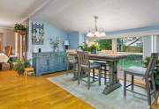 The sloping ceiling over the breakfast nook adds interest to the comforting space