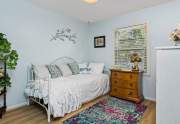 A comfortable-size bedroom perfect for a single guest or family member