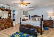 The master bedroom has a spacious walk-in closet