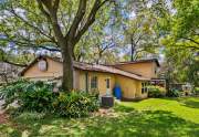 Enter the back yard through the utility room or the screened patio at the far end