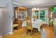 The dining room also has a lovely view of the lush green landscape in the back yard