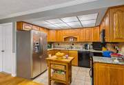 Remodeled kitchen with granite countertops, wood cabinets and stainless steel appliances